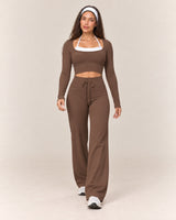 By Shybani Flow Square-Neck Long-Sleeve Top in Brown — front stepping pose