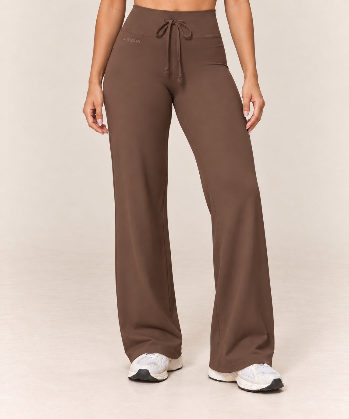 By Shybani Flow Wide-Leg Trousers in Brown — front studio product view