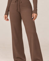By Shybani Flow Wide-Leg Trousers in Brown — wide-leg drape detail
