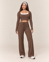 By Shybani Flow Wide-Leg Trousers in Brown — front standing