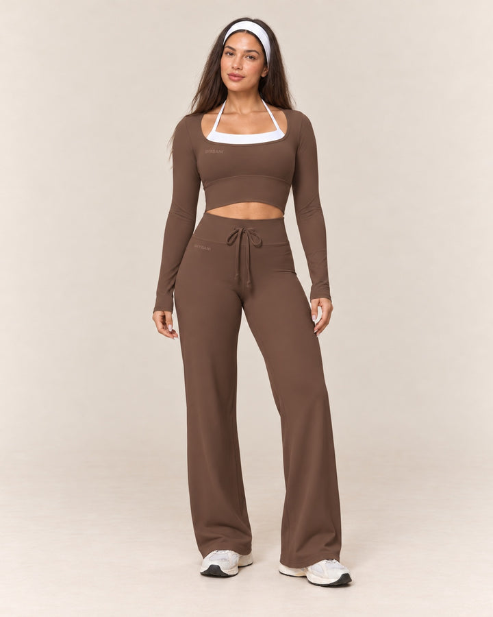 By Shybani Flow Wide-Leg Trousers in Brown — front standing