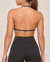 By Shybani Halter Sports Bra in Black — back strap detail