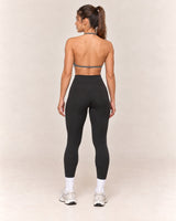 By Shybani Halter Sports Bra in Dark Grey — back