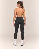 By Shybani Halter Sports Bra in Olive Green — back
