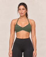 By Shybani Halter Sports Bra in Olive Green — front