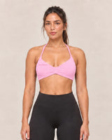 By Shybani Halter Sports Bra in Pink — front