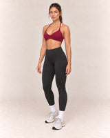 By Shybani Halter Sports Bra in Wine Red — front three-quarter