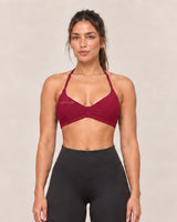 By Shybani Halter Sports Bra in Wine Red — front