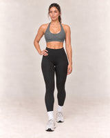 By Shybani Scoop-Neck Halter Bra in Dark Grey — front step