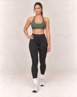 By Shybani Scoop-Neck Halter Bra in Olive Green — front step